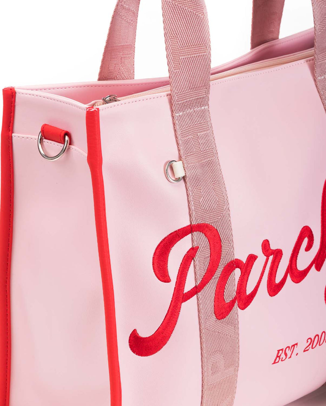 Bolso para mujer en PVC grande con bolsillos internos color rosado y correa ajustable ajustable